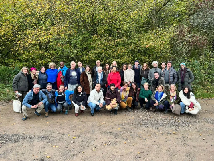 group of smiling adults outside