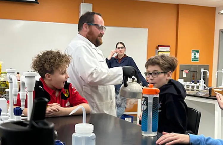 Middle school students view a chemistry demonstration