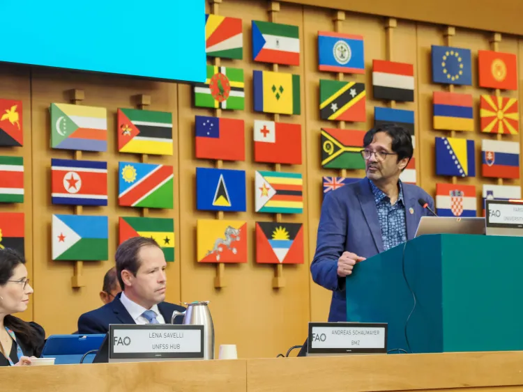 Man addresses side event at Committee on World Food Security in Rome.
