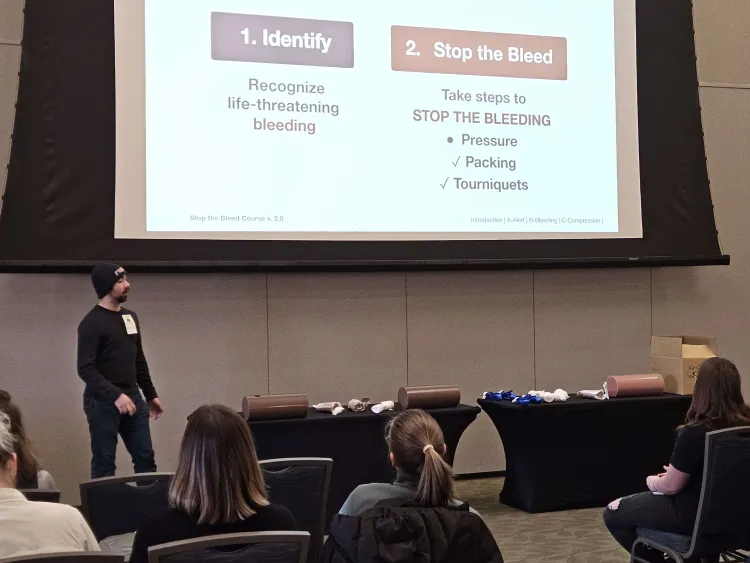 student delivers stop the bleed training lecture