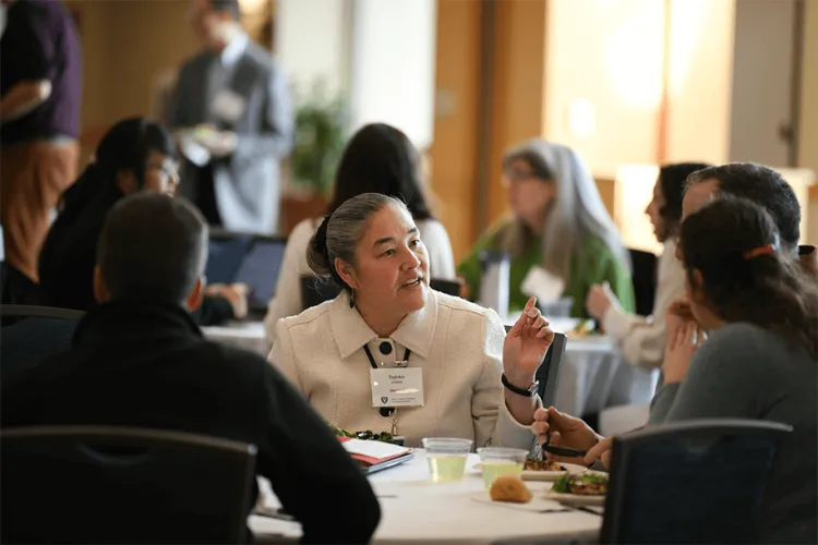 people sitting at a table talking