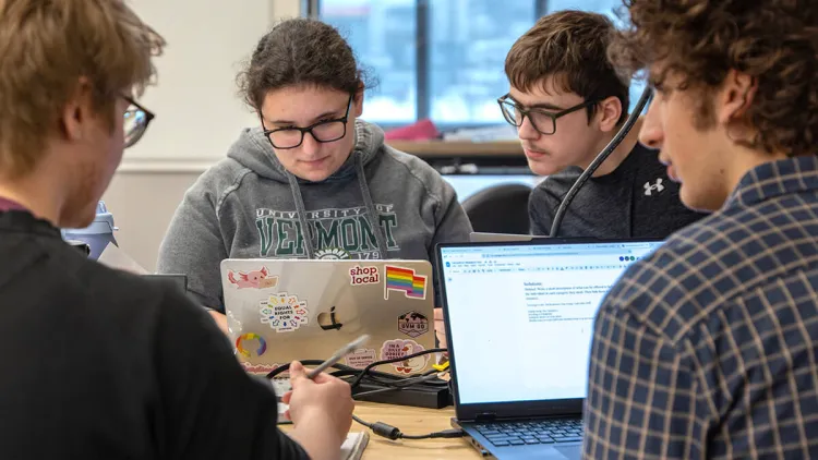 Students collaborate on their laptops during the 2026 Hackathon
