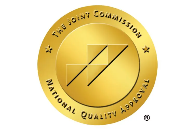 Joint Commission Gold Seal with text The Joint Commission National Quality Approval
