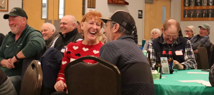 Farmer laughing at Rusty Dewees