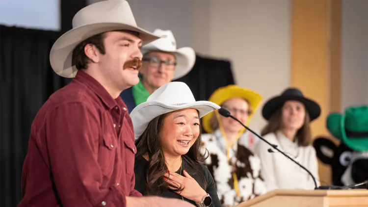 people in cowboy hats on a stage