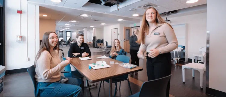 Occupational therapy students debrief in the smart apartment