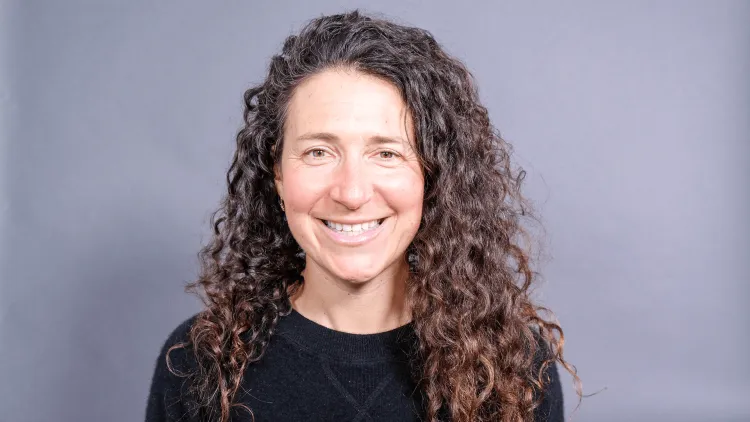 headshot of a person smiling