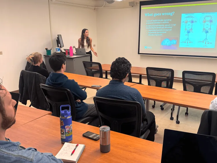 Student presenting her scientific research for her Honors Thesis