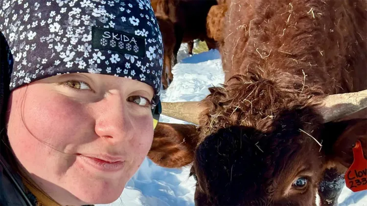 close-up of young woman in Skida hat with brown cow