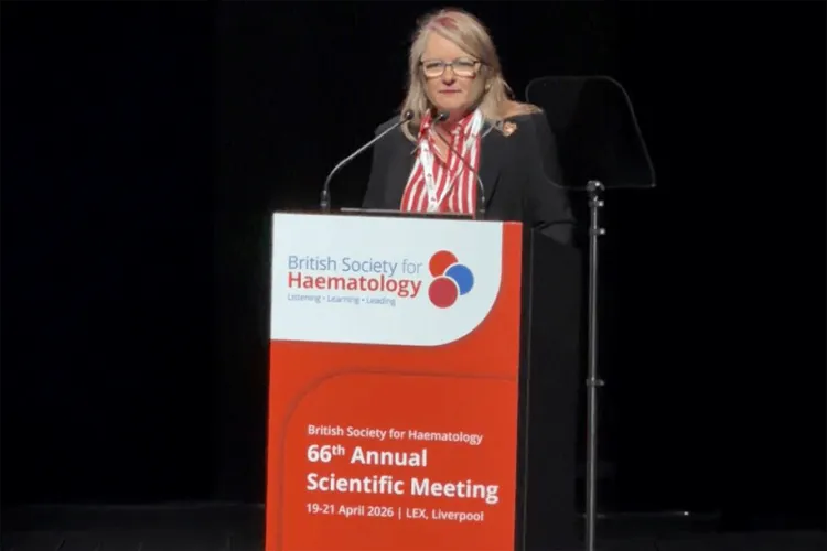 Person speaking at a podium. 