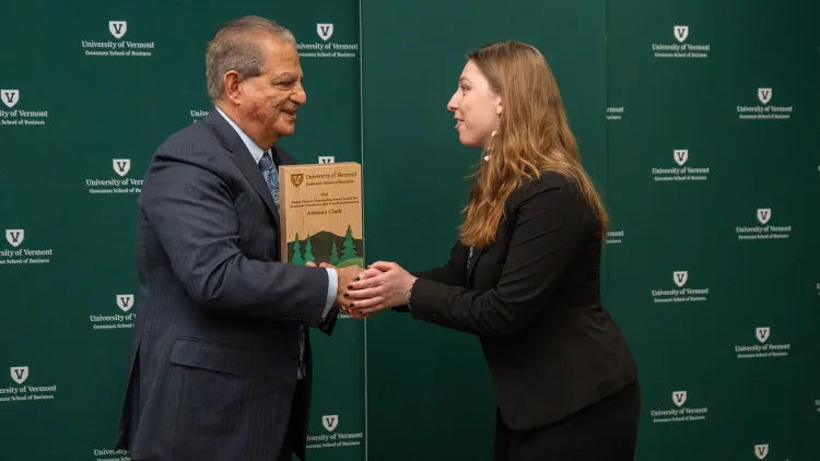 Retiring Dean Sanjay Sharma presents Arianna Clark with the Outstanding Junior award recently named after him