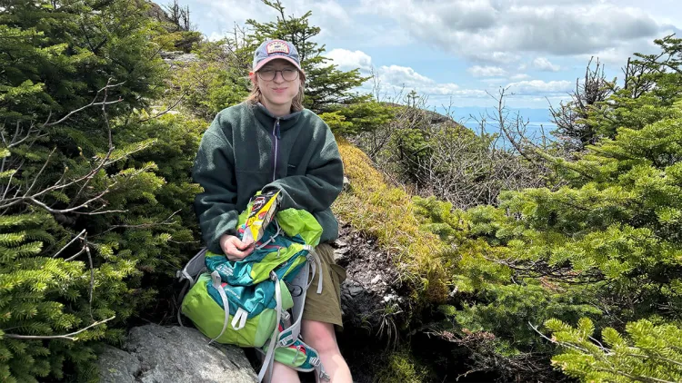 Jes Bennett taking a break during a hike in the Green Mountains