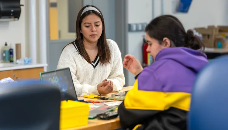 Alisson Fernandez Tuiro works with research partner Jackie Berk on their senior capstone project, an endoscopic carpal tunnel release tool modified to enable monopolar electrocautery.