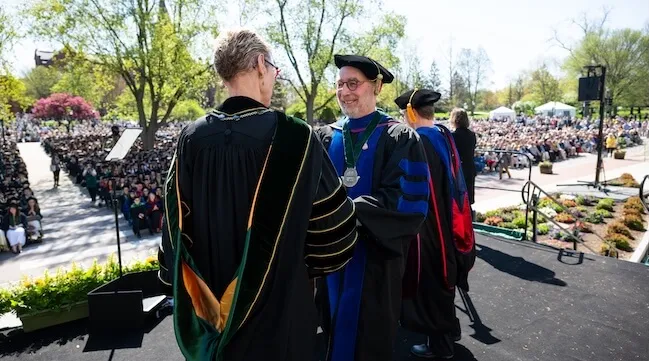 Two figures in academic robes