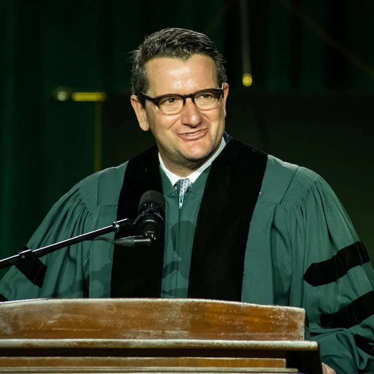 Mark DiMichaelis delivers the keynote address at commencement to the Grossman School at UVM