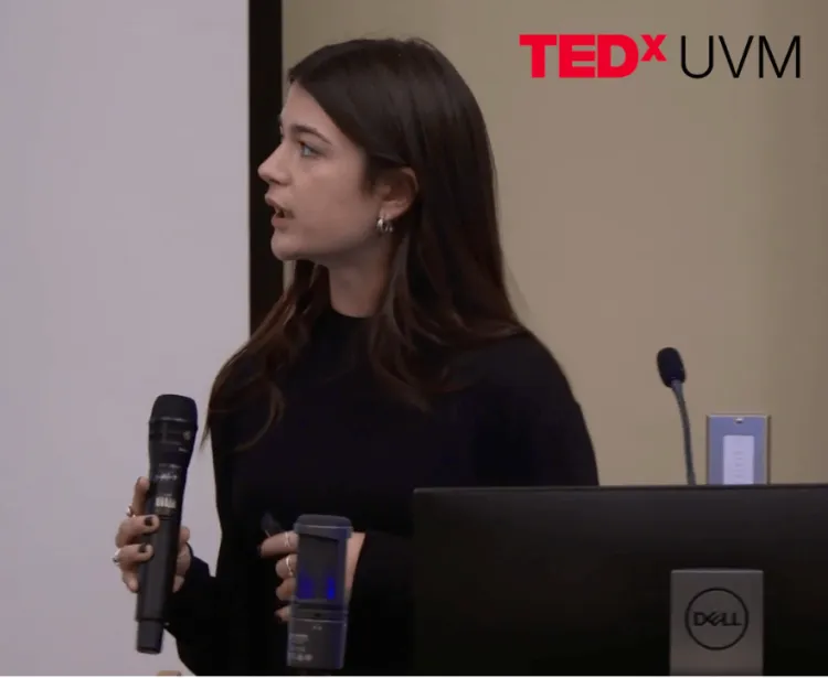 Young woman giving a TEDX UVM talk