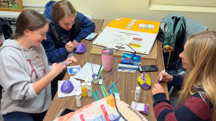 NSSLHA students painting rocks for DLD awareness day