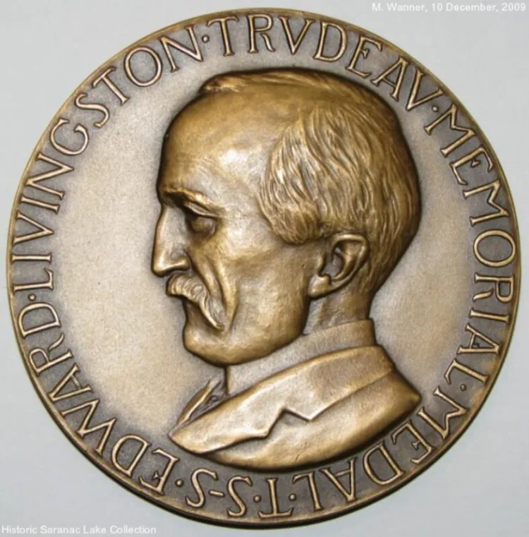 a circular medal with a person's head in profile, with the words Edward Livingston Trudeau Memorial Medal around the outer edge