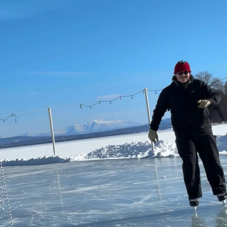 Carlos skating on a pond.