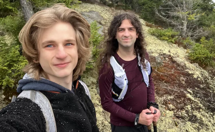 Crow Stephenson hiking with a friend