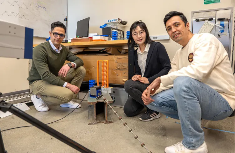PhD researcher Soroush Soltani, Mechanical Engineering Assistant Professor Jihong Ma, and PhD researcher Amir Rajabpoor Alisepahi use the scanning laser Doppler vibrometer (SLDV) in the Advanced Materials Lab.