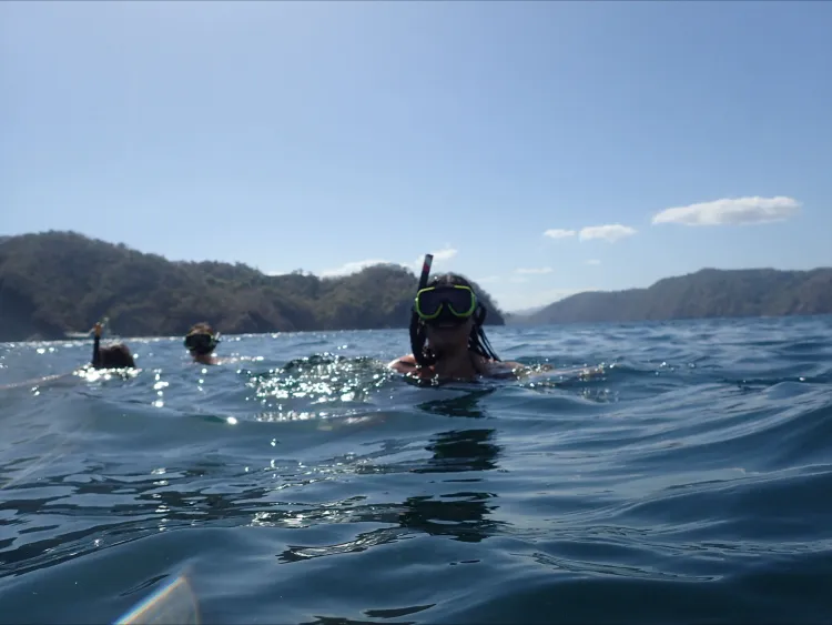Nina snorkeling in a lake.