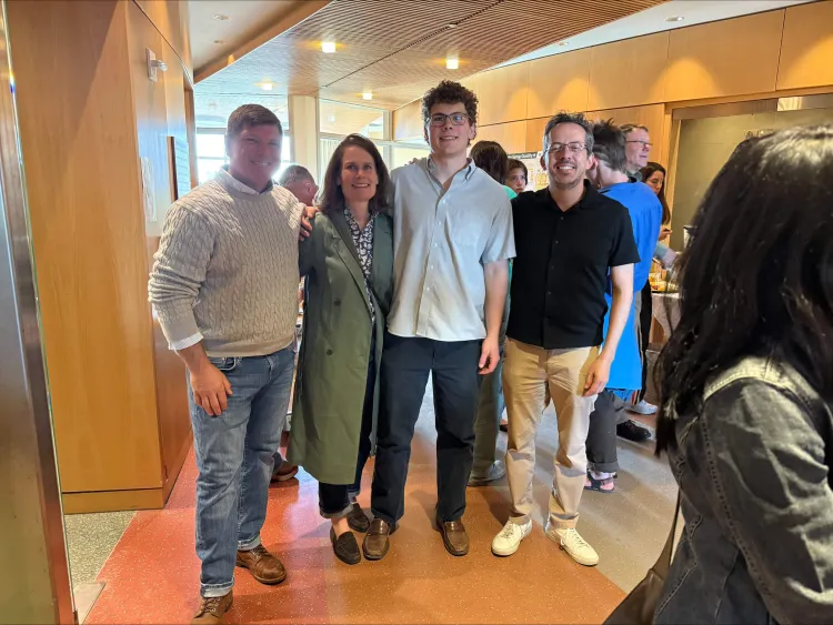 4 adults at an art opening