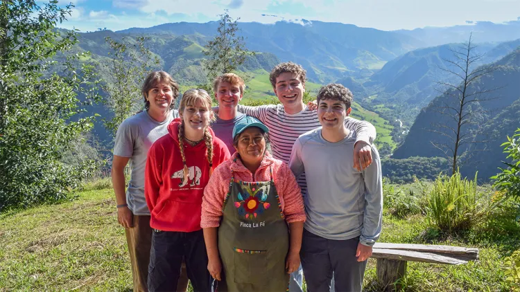 Gabe Johnson, Ginger Thralow, Henry Myatt, Finn Duncan, and Finn Dabish pose with a local resident of the Intag in Ecuador.