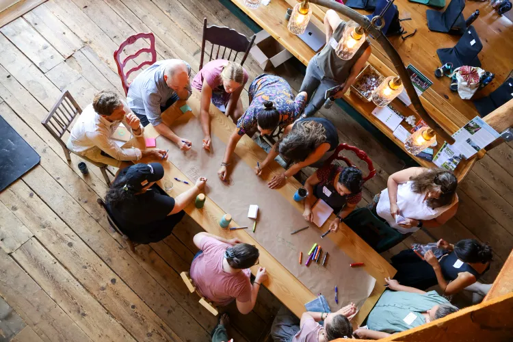 people gather around a table