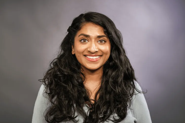 Person smiling at the camera inside.