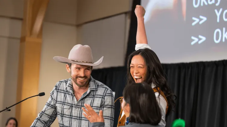 a couple celebrating at a podium