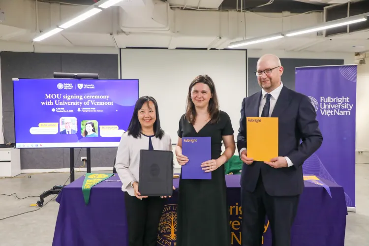 Administrators from UVM and Fulbright University Vietnam celebrate new partnership