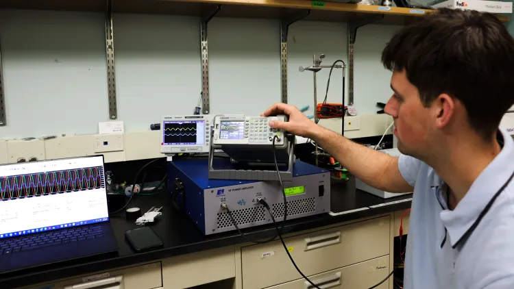 Petrie demonstrates machine with wave lengths