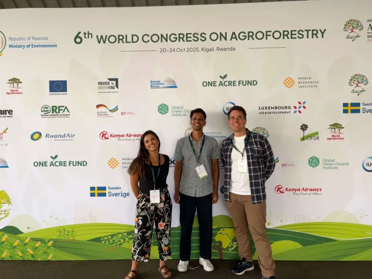 Three people at a conference