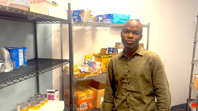 A man standing in a food pantry