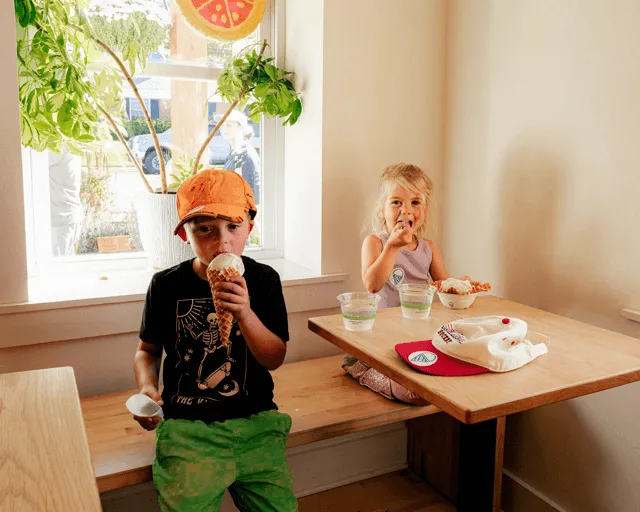 two happy kids eating ice cream