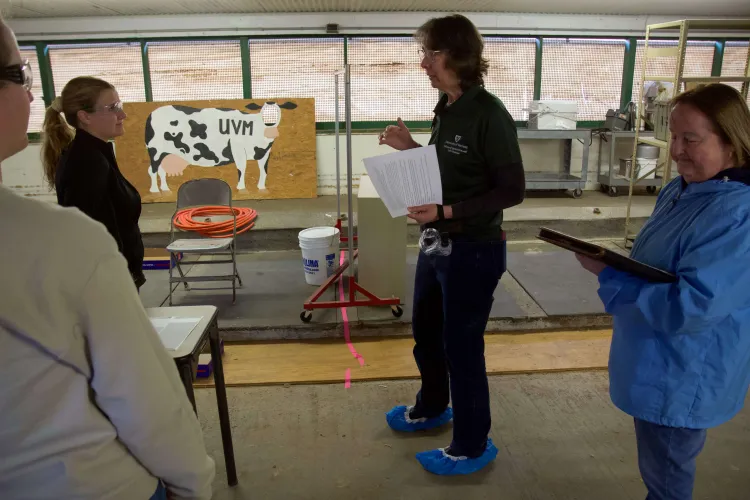 A professor instructs students in a biosecurity game