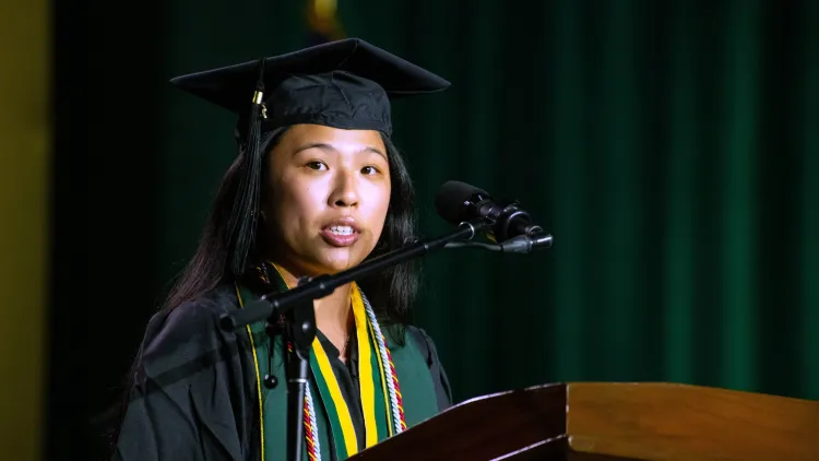 An exercise science graduate speaks during the 2026 CNHS commencement celebration