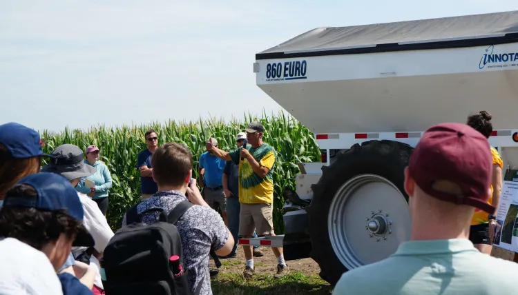 Event guests around farm equipment