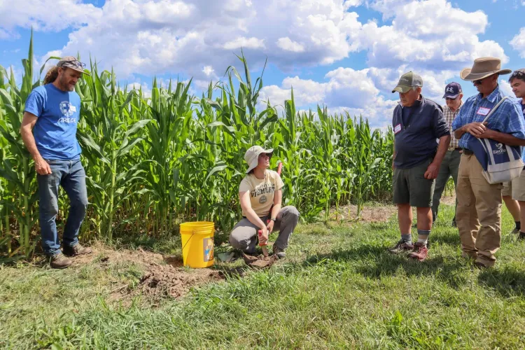 researcher soil sampling