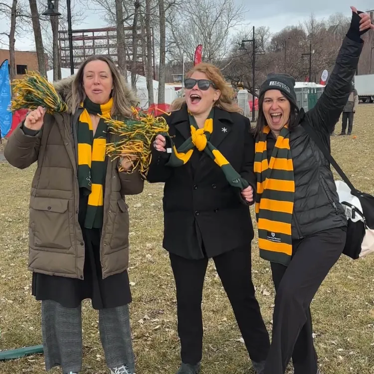 (left to right) Jana Beagley, Heather Winther, and Sarah O'Sullivan cheer at the 2026 Penguin Plunge