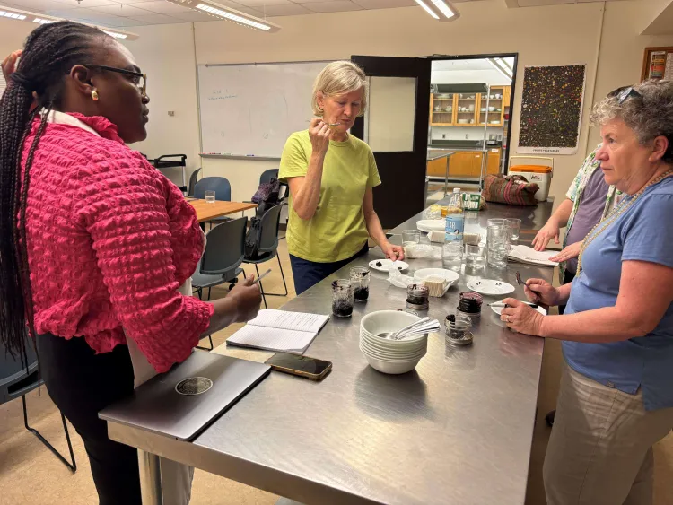 3 people taste testing aronia berry jam