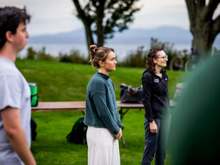 A Sustainable Innovation MBA students stands outside with other See Change participants.