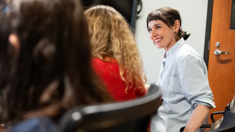 Meg Little Reilly smiles during a meeting with students