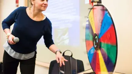 Student spinning wheel in Active Learning classroom. 