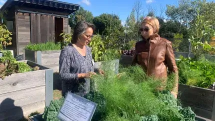 two women touring a garden