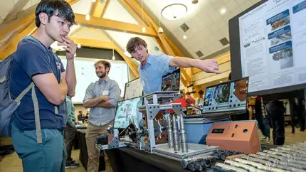 An engineering student shares his project at the annual Design Night event.