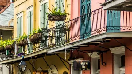 Colorful pink and yellow buildings with balconies in New Orleans, LA