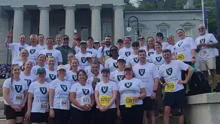 employees on the Vermont capital steps before a race