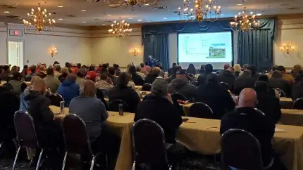 hotel conference room view of audience from back looking at presentation screen